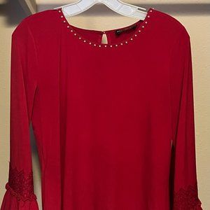 Karl Lagerfeld Paris / red top with white pearls around the neck.